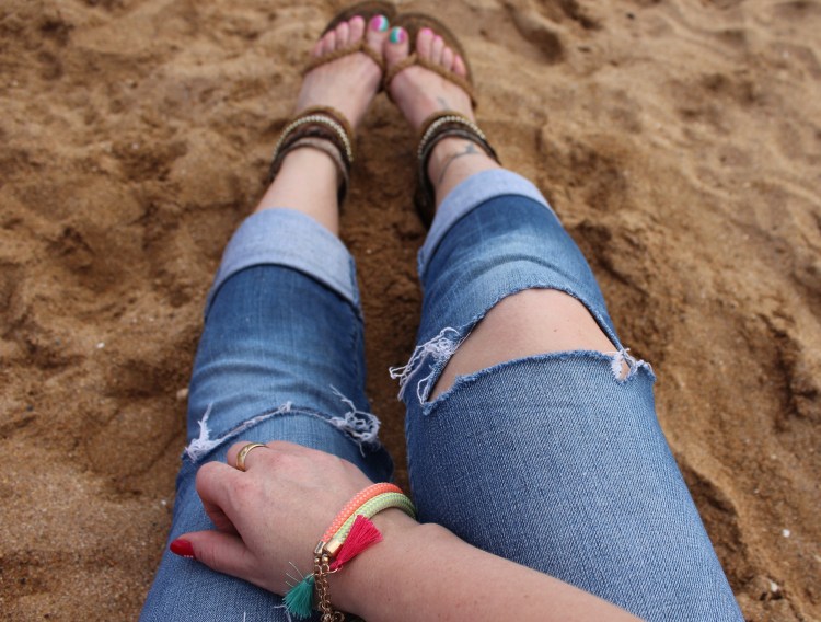 Striped-shirt-distressed-denim-beach-outfit