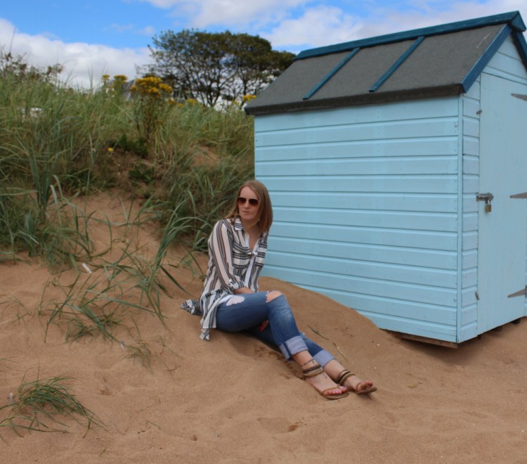 Striped-shirt-distressed-jeans-beach-outfit