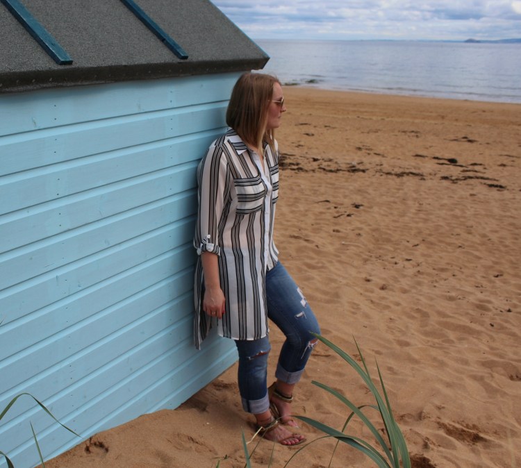Striped-shirt-distressed-jeans-beach-outfit
