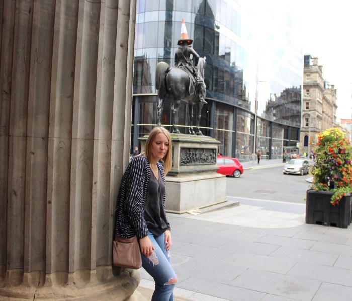 Ripped jeans oversized shirt layered street style W=700 H=598 Ripped-jeans-oversized-shirt-layered-street-style