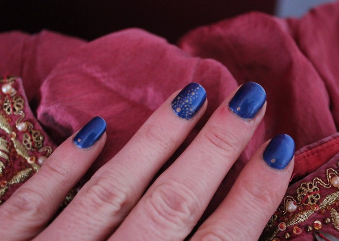 Egyptian-navy-gold-dotted-nail-art